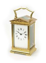 A 20TH CENTURY ARCHITECTURAL BRASS-CASED TIMEPIECE CARRIAGE CLOCK