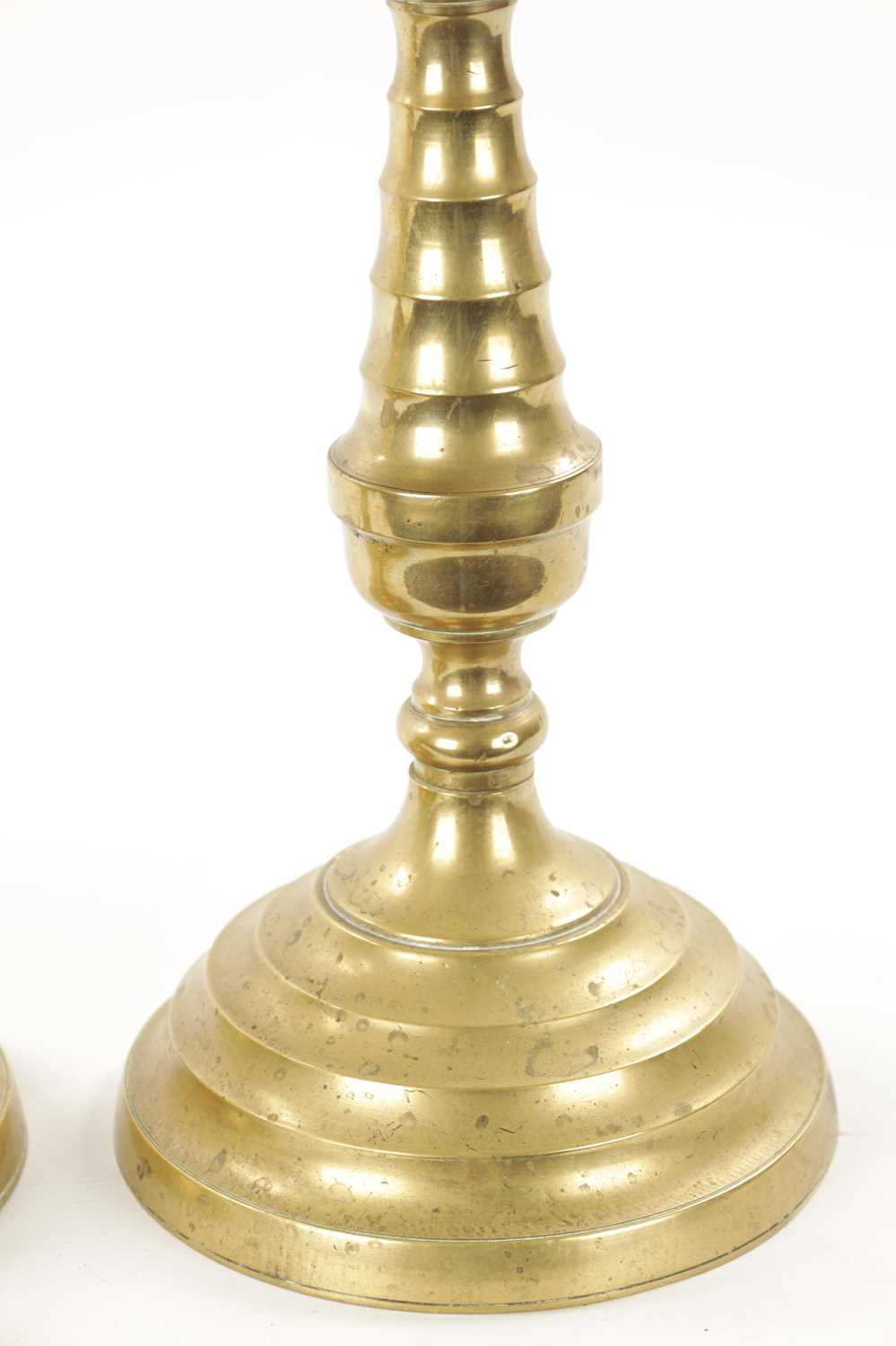 A LARGE PAIR OF 18TH CENTURY BRASS CANDLESTICKS - Image 6 of 9