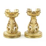 A PAIR OF EARLY 19TH CENTURY GILT ORMOLU FIRE DOGS