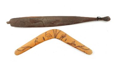 AN ABORIGINAL MULGA WOOD SPEAR THROWER WITH CARVED ANIMALS AND AN OLD BOOMERANG.
