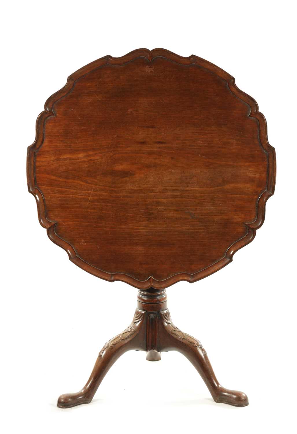 AN 18TH CENTURY FIGURED MAHOGANY PIE CRUST TRIPOD TABLE ON MANX FEET