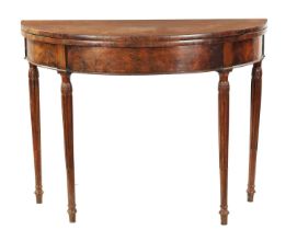 A LATE 18TH CENTURY DEMI LUNE CARD TABLE ON FLUTED LEGS IN THE MANNER OF GILLOWS