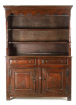 AN EARLY 18TH CENTURY OAK POSTED CANOPY DRESSER