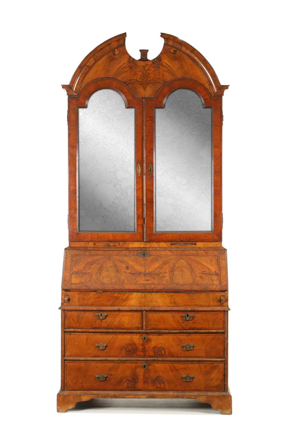 AN EARLY 18TH CENTURY FIGURED WALNUT AND OAK BREAK ARCHED TOP BUREAU BOOKCASE