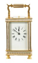 A LATE 19TH CENTURY GILT BRASS AND SILVERED REPEATING CARRIAGE CLOCK