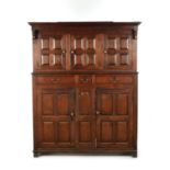 AN EARLY 18TH CENTURY PANELLED OAK DUDARN