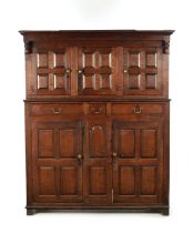 AN EARLY 18TH CENTURY PANELLED OAK DUDARN