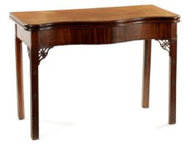 A FINE OVERSIZED GEROGE III SERPENTINE MAHOGANY TEA-TABLE IN THE MANNER OF THOMAS CHIPPENDALE
