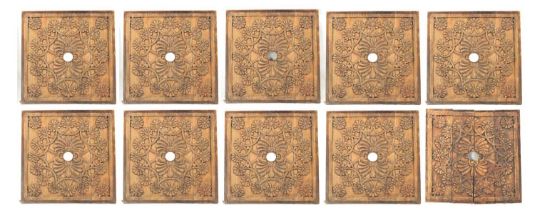 A SET OF TEN CARVED CEILING PANELS FROM 'GANESHI HOTEL LONDON'