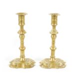 A PAIR OF MID 18TH CENTURY SEAMED CAST BRASS CANDLESTICKS