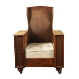 AN ARTS AND CRAFTS METAMORPHIC OAK ARMCHAIR