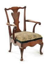 AN 18TH CENTURY FIGURED MAHOGANY COMMODE CHAIR