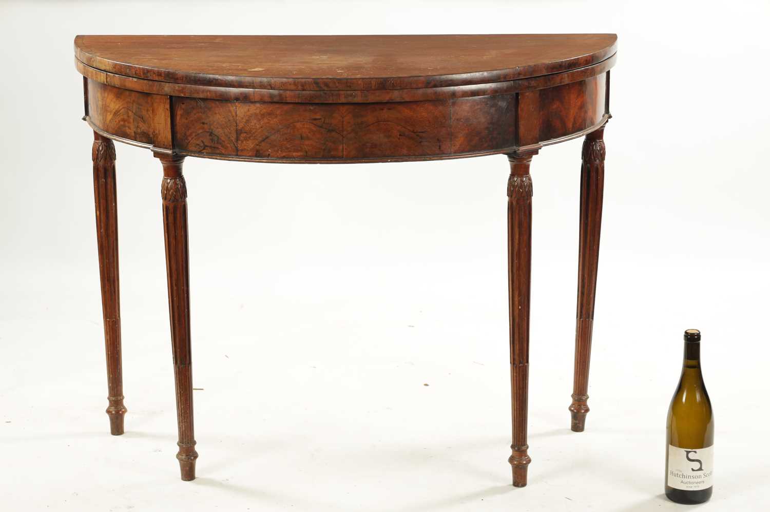 A LATE 18TH CENTURY DEMI LUNE CARD TABLE ON FLUTED LEGS IN THE MANNER OF GILLOWS - Image 2 of 7