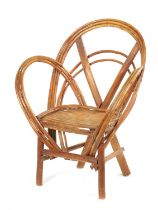 A 19TH CENTURY CANED BENT WOOD CHILD’S CHAIR