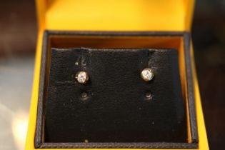 Pair of 9ct Gold Diamond set studs 1.2g total weight