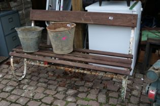Wrought Iron scroll bench with wooden supports
