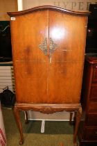 Walnut Drinks cabinet with fitted interior over long cabriole legs