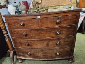 Victorian Mahogany bow front ed chest of 2 over 3 drawers supported on turned feet
