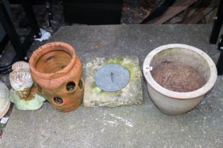 Collection of garden pots and a Sundial