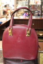 Vintage 1980s Cartier Burgundy satchel type handbag with brass fittings 26cm in Width