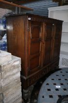 Oak Panel front Drinks cabinet on carved baluster supports