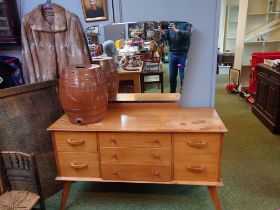 Mid Century Walnut Dressing table of Seven drawers over splayed legs and mirror to back