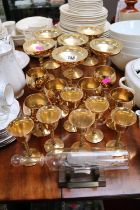 Collection of Spanish Gold Plated Goblets and drinking vessels and a glass boat in bottle