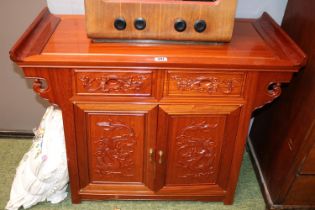 Chinese hardwood Altar table of two carved drawers above carved cupboard base