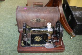 The Singer Sewing machine in Walnut case