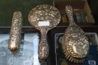3 Piece Silver Cherub decorated Dressing table set comprising of a Hand Mirror and 2 brushes