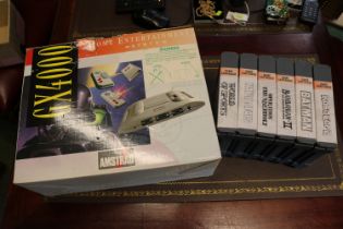 Vintage Amstrad GX400 in original box with various games inc Robo Cop 2 etc