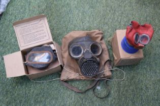 Three WW2 Gas Masks with boxes