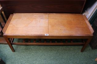 Danish style mid century teak coffee table with opening top.