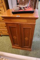 Walnut two door cabinet with shelves to interior with inlaid panel doors. 78cm in Height