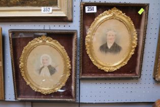 Pair of 19thC Hand Coloured Portraits within Oval ornate highly gilded frames glazed and cased