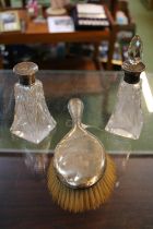 2 Silver topped Cut glass scent bottles and a Silver Backed dressing table brush