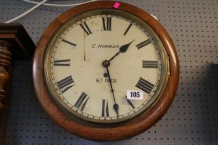 C Norman of St Ives Mahogany cased circular wall clock with Roman numeral dial