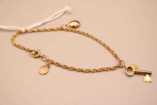 18ct Gold Ladies chain (tested) with 9ct Gold Charms 6.1g total weight