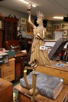 Interesting Statue of Liberty design weighted rocking figure on long slender base