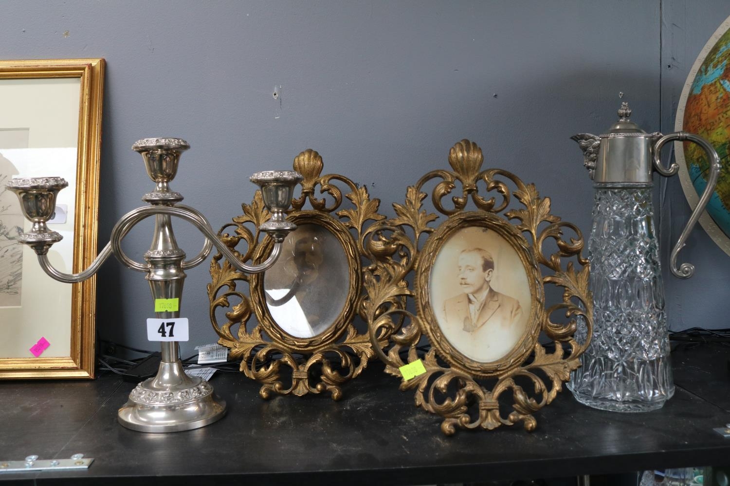 Pair of Gilt foliate metal oval picture frames and a Silver plated candelabra and a pressed glass