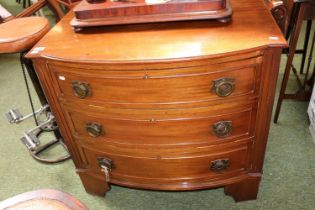 Aesthetics Movement bow fronted chest of 3 drawers with Brass drop handles over bracket feet