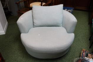 Upholstered revolving love seat