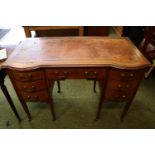 Edwardian Ladies Inlaid writing desk with Leather top and seven drawers supported on tapering legs
