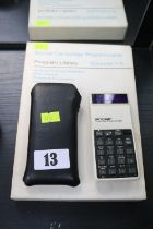 Vintage Sinclair Calculator with a Sinclair Cambridge Programmable Volumes 1-4 Program Library