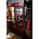 Chinese Hardwood Glazed 8 shelf cabinet over cupboard base decorated with prunus