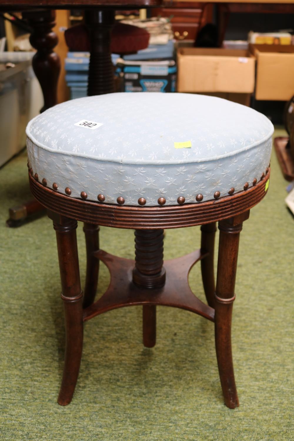 Circular Upholstered Piano stool on splayed legs