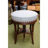 Circular Upholstered Piano stool on splayed legs