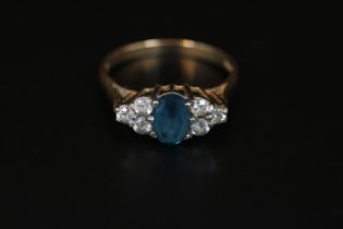 Ladies 9ct Gold Blue Topaz and Diamond set ring with open mount Size K. 2.2g total weight