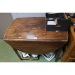 Regency Drop Leaf table with single drawer over tapering legs and brass casters