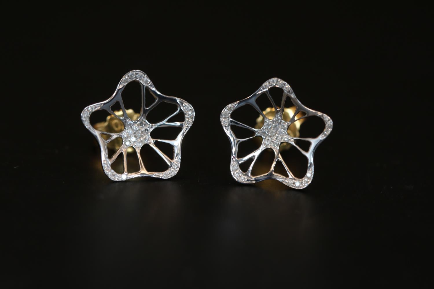 Pair of 18ct White Gold Diamond set Flower design earrings
